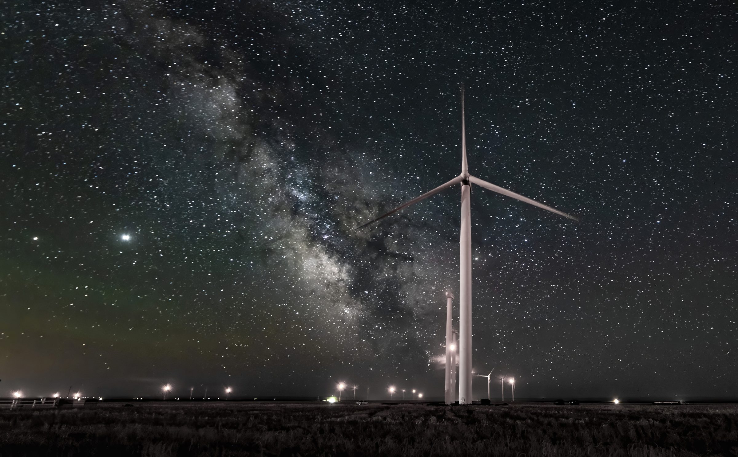 Giants in the Night — One giant still turning under the whole Milky Way.